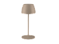 Bež stolna lampa sa sjenilom u obliku kupole i okruglim postoljem na crnoj pozadini
