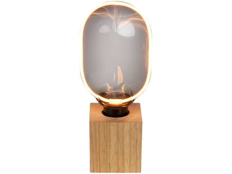 Stolna lampa s drvenim postoljem i ovalnom staklenom žaruljom s osvjetljenjem.