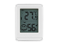 Bijeli digitalni termometar i higrometar s LCD zaslonom, prikazuje 27.9°C i 56% vlage.