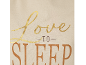 Krem majica sa zlatnim i smeđim tekstom „Love to Sleep“.