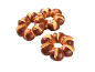 Dva okrugla, pletena kruha s tamnosmeđom korom i svijetlom sredinom.
