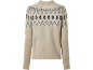 Bež džemper s crno-bijelim Fair Isle uzorkom.
