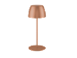 Bakrena stolna lampa s okruglom bazom i sjenilom u obliku kupole.