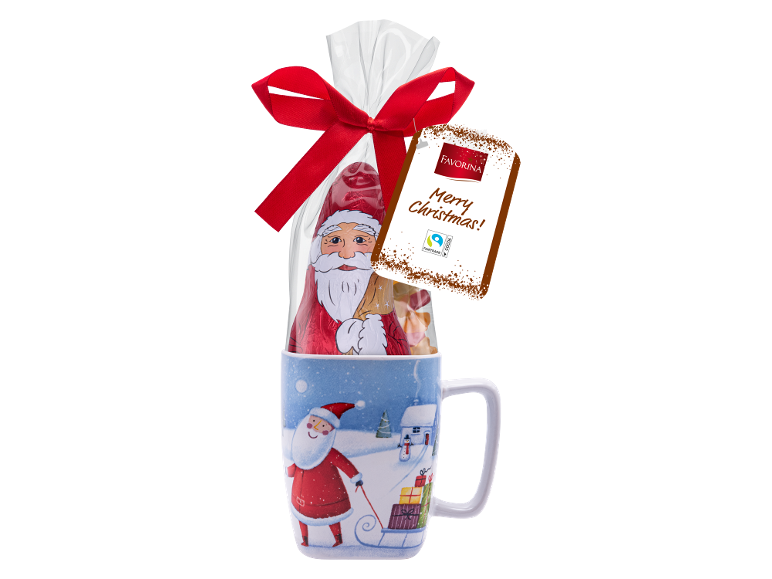 Božićna šalica s čokoladnim Djedom Božićnjakom i slatkišima, s natpisom „Merry Christmas“.