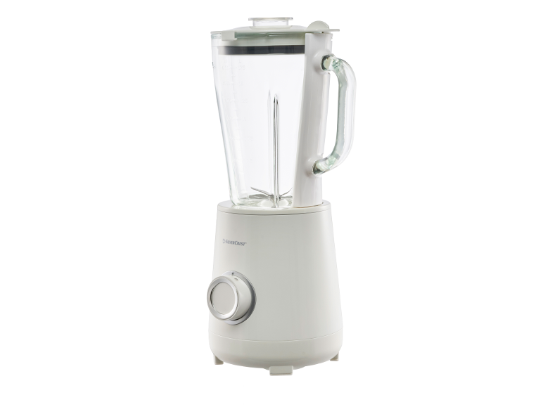 Bijeli blender sa staklenim vrčem, poklopcem i ručkom, s kontrolnim kotačićem.