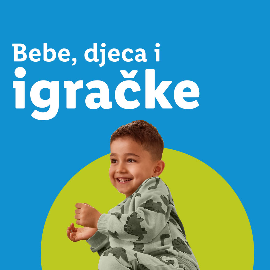 Bebe, djeca i igračke: nasmijano dijete u pidžami s dinosaurusima.